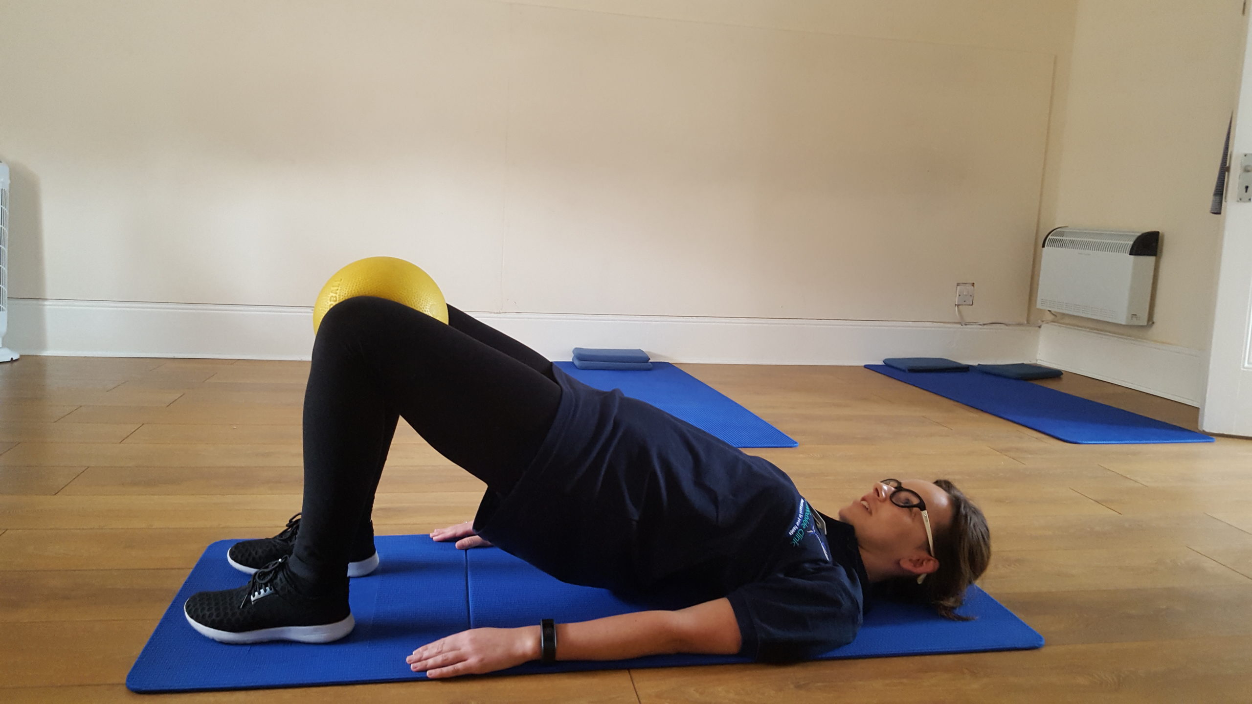 pilates for back pain - shoulder bridge Woodside Clinic osteopathy pilates